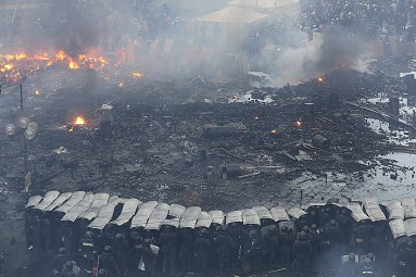 Interior Ministry members stand in formation during clashes with anti-government protesters at Independence Square in central Kiev